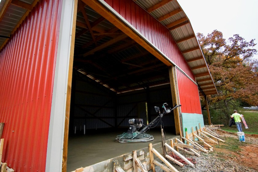 red barn with concrete polishing machine