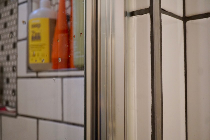 custom tiled shower with schluter rails