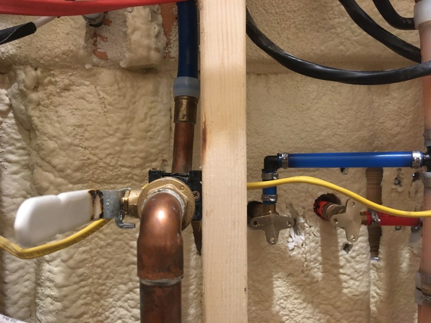 plumbing structure on a sprayfoam wall