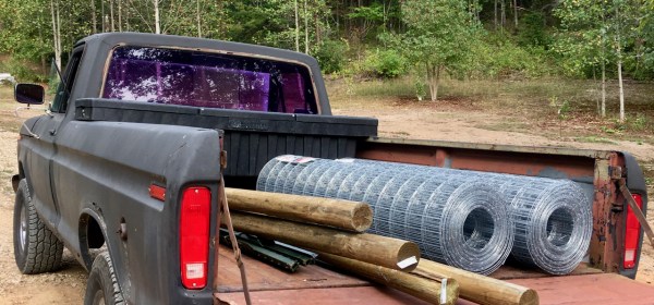 classic F-150 with wire and fence posts in the bed